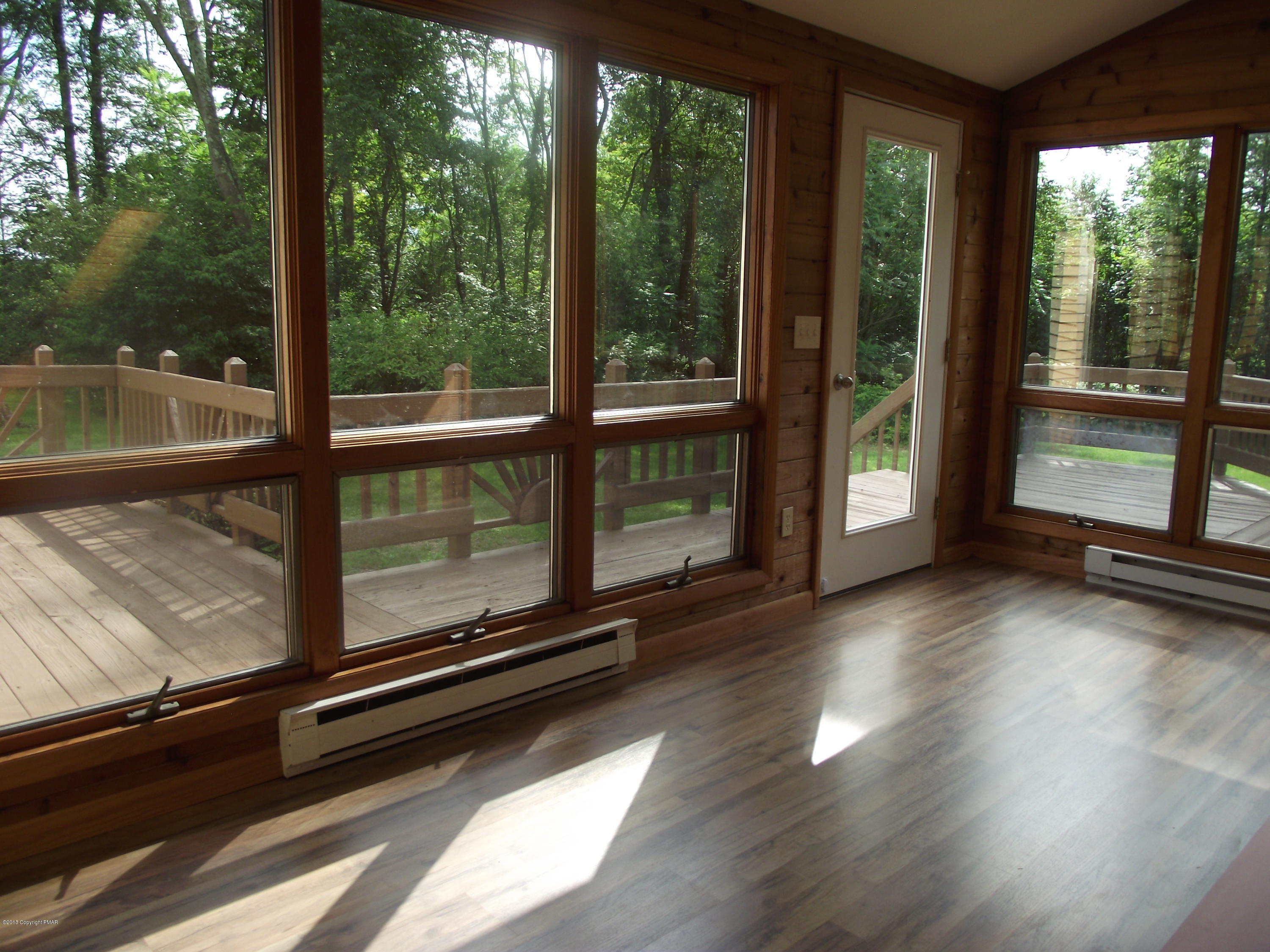684 Gilbert Road Gilbert, PA 18331 - Photo 8 of 31 a view of a room with wooden floor and windows