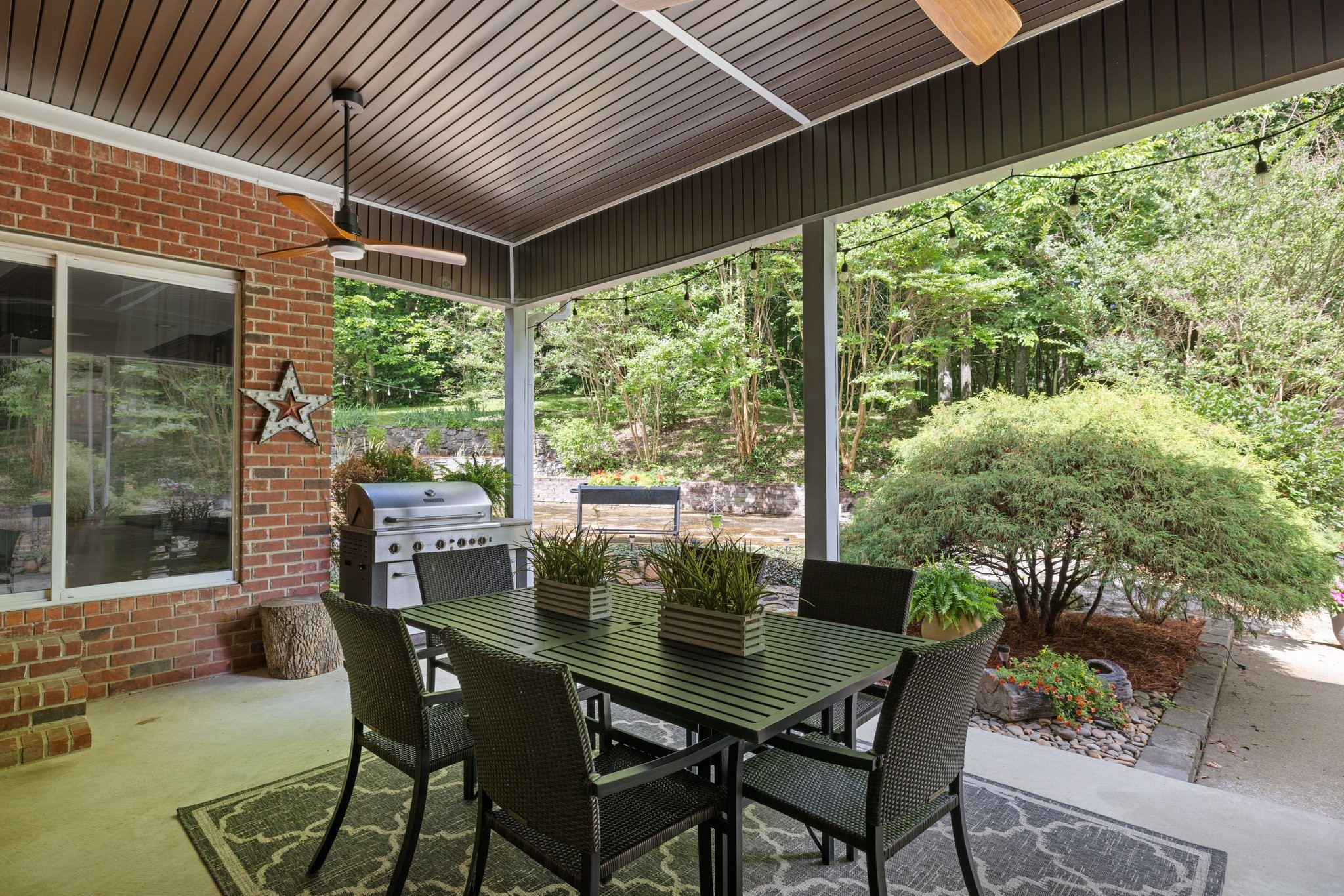 5375 Murfreesboro Road College Grove, TN 37046 - Photo 16 of 70 a view of an outdoor dining space with a table and chairs