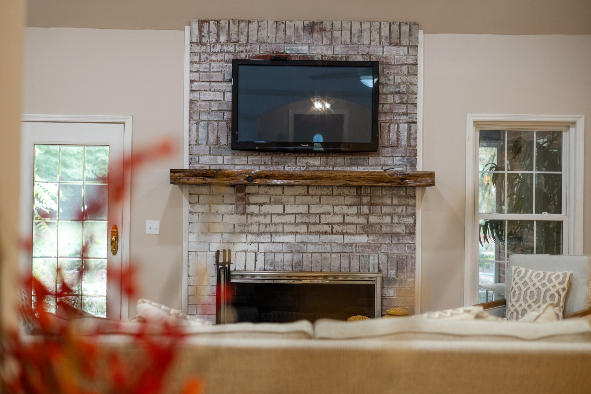 5375 Murfreesboro Road College Grove, TN 37046 - Photo 30 of 70 a living room with a fireplace a flat screen tv and a fireplace