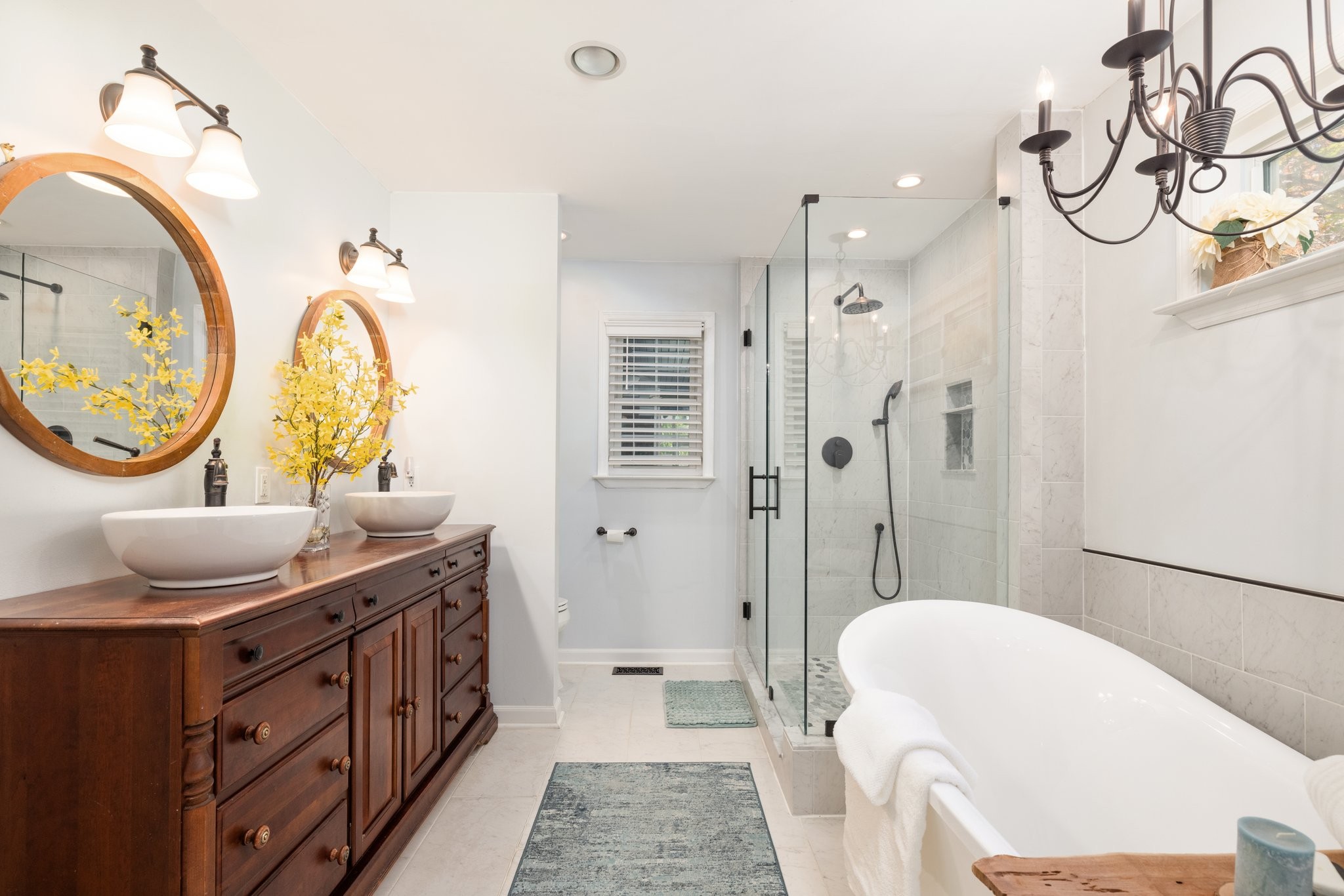 5375 Murfreesboro Road College Grove, TN 37046 - Photo 34 of 70 a bathroom with a granite countertop sink a mirror a vanity and a shower