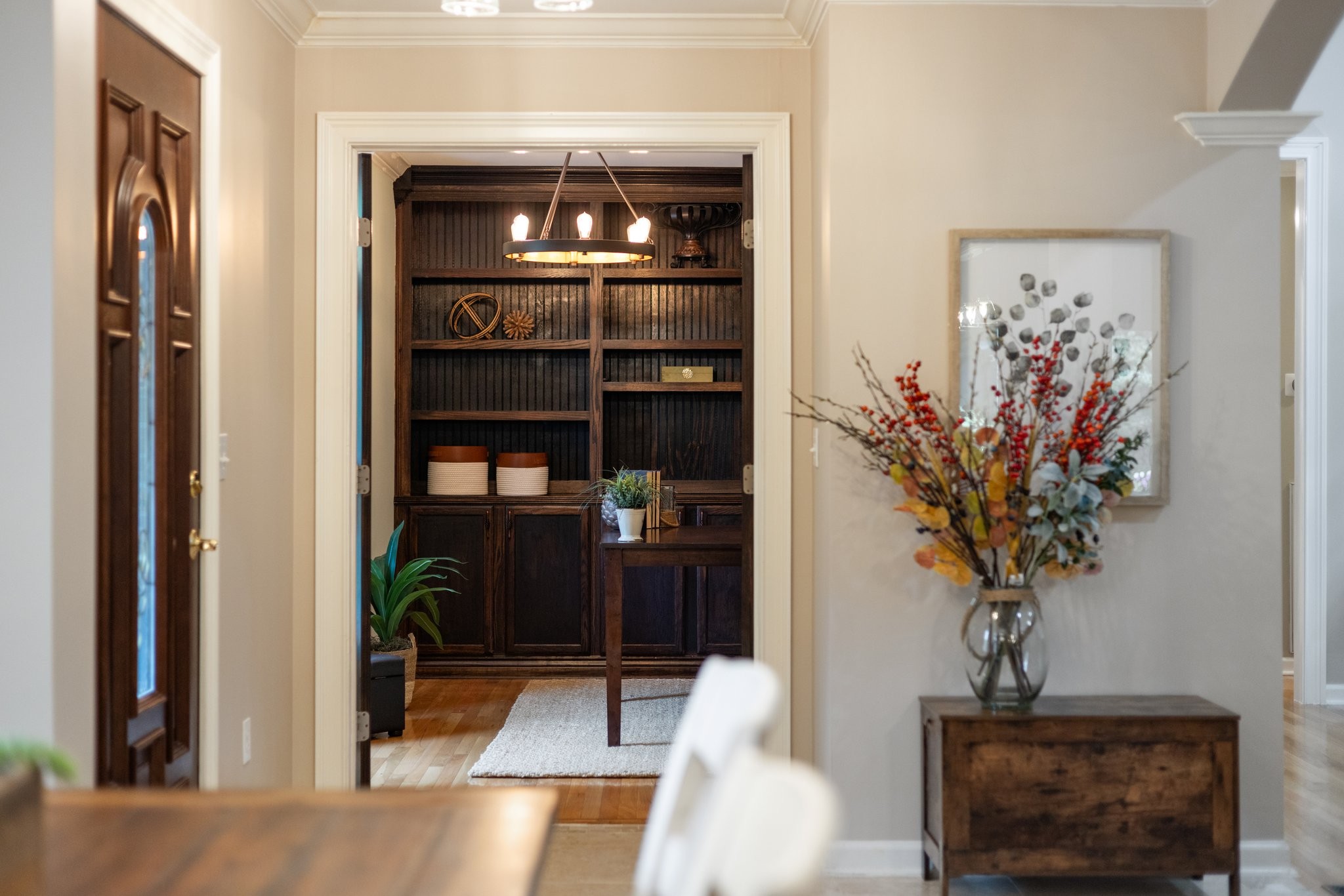 5375 Murfreesboro Road College Grove, TN 37046 - Photo 6 of 70 a view of a hallway with wooden floor and a potted plant