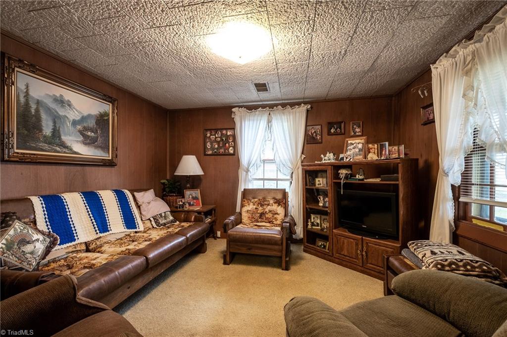 872 Benham Church Road Elkin, NC 28621 - Photo 15 of 30 Interior of home features den and living rooms.
