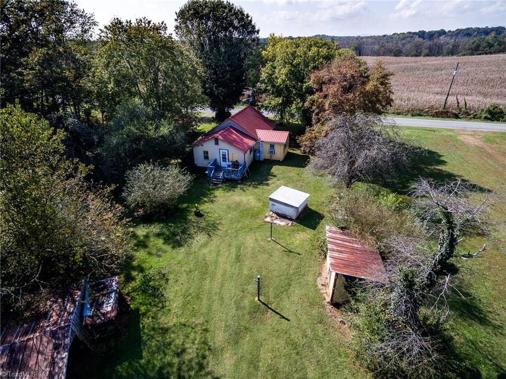 872 Benham Church Road Elkin, NC 28621 - Photo 3 of 30 1940s farm house on approx. 10.6+/- acres with mountain views, barns and outbuildings.