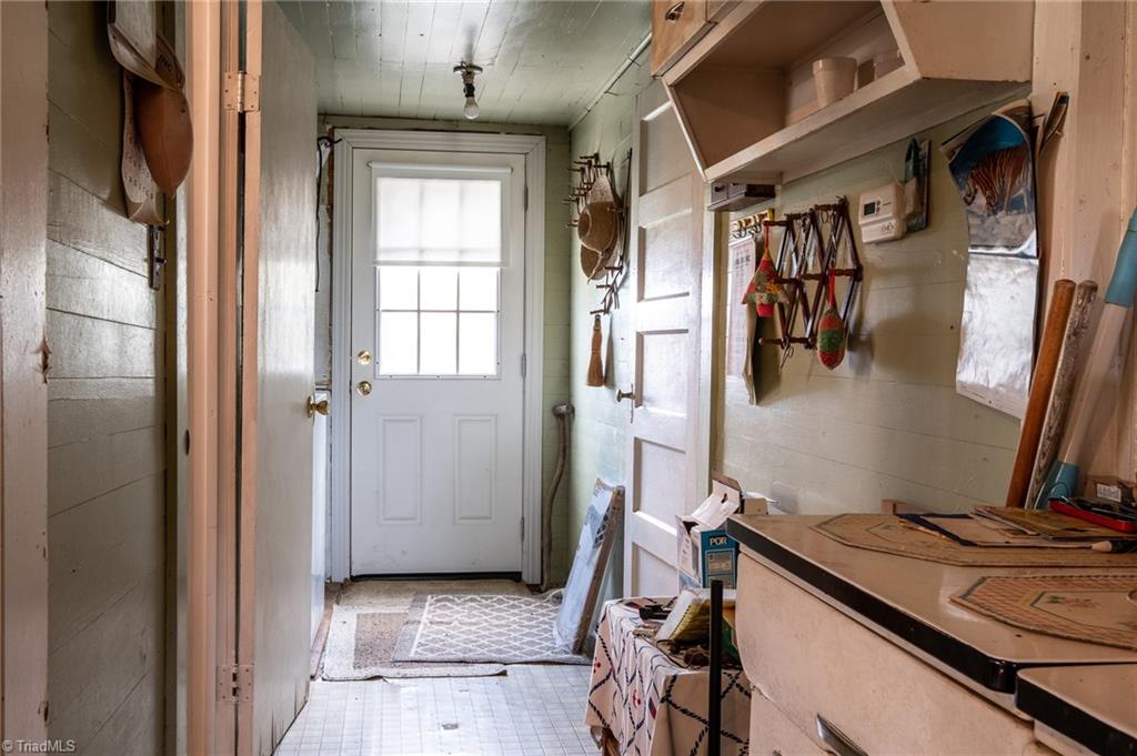 872 Benham Church Road Elkin, NC 28621 - Photo 23 of 30 Back hallway leads to laundry room.