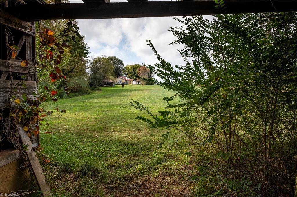 872 Benham Church Road Elkin, NC 28621 - Photo 26 of 30 View from inside barn looking toward rear of home.