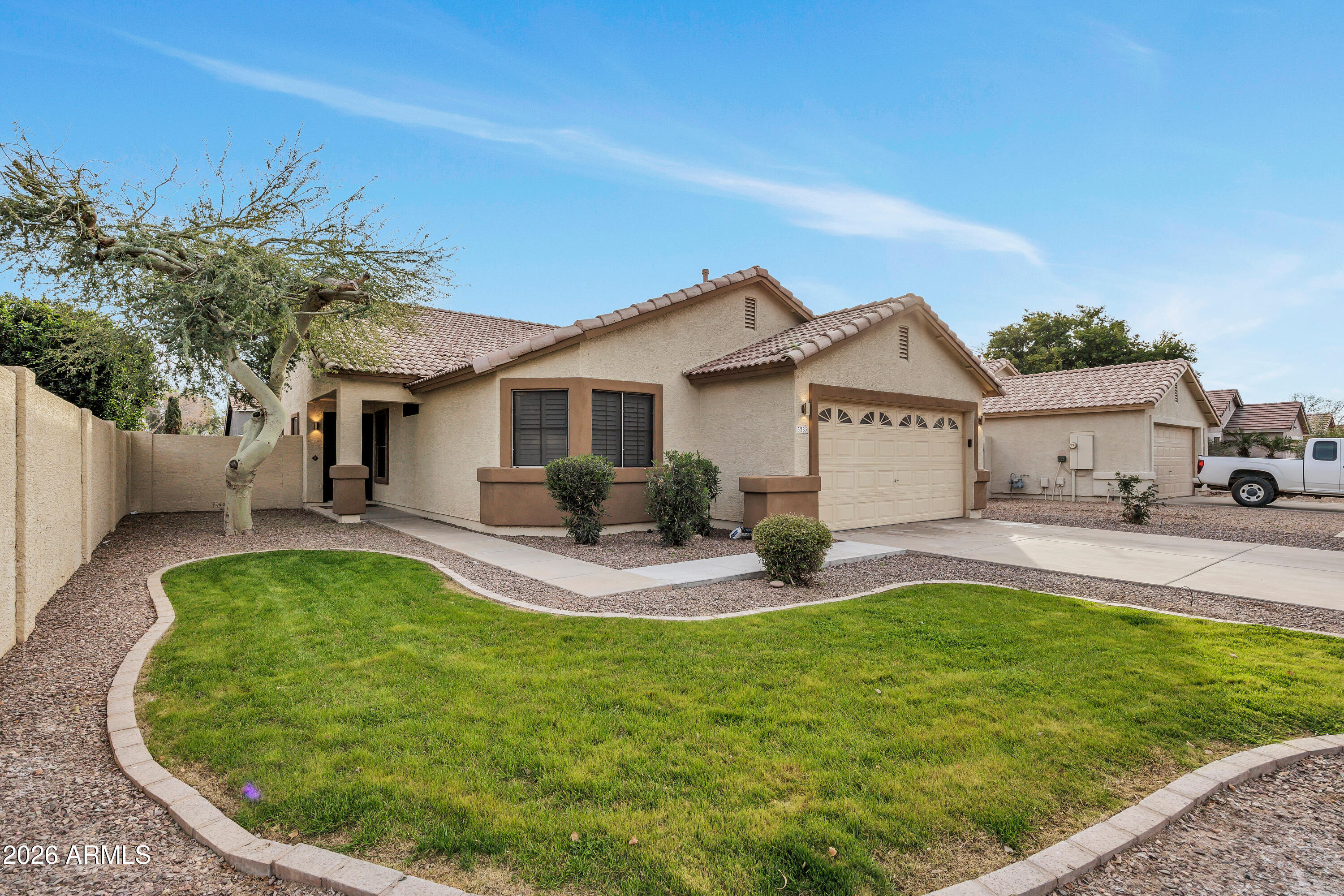 3283 East Bonanza Road Gilbert, AZ 85297 - Photo 12 of 31 a view of a house with a yard patio and fire pit