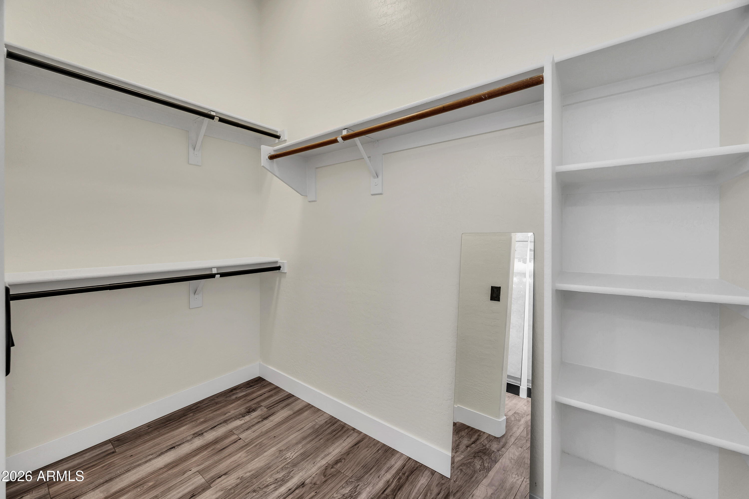 3283 East Bonanza Road Gilbert, AZ 85297 - Photo 24 of 31 a view of walk in closet with empty racks