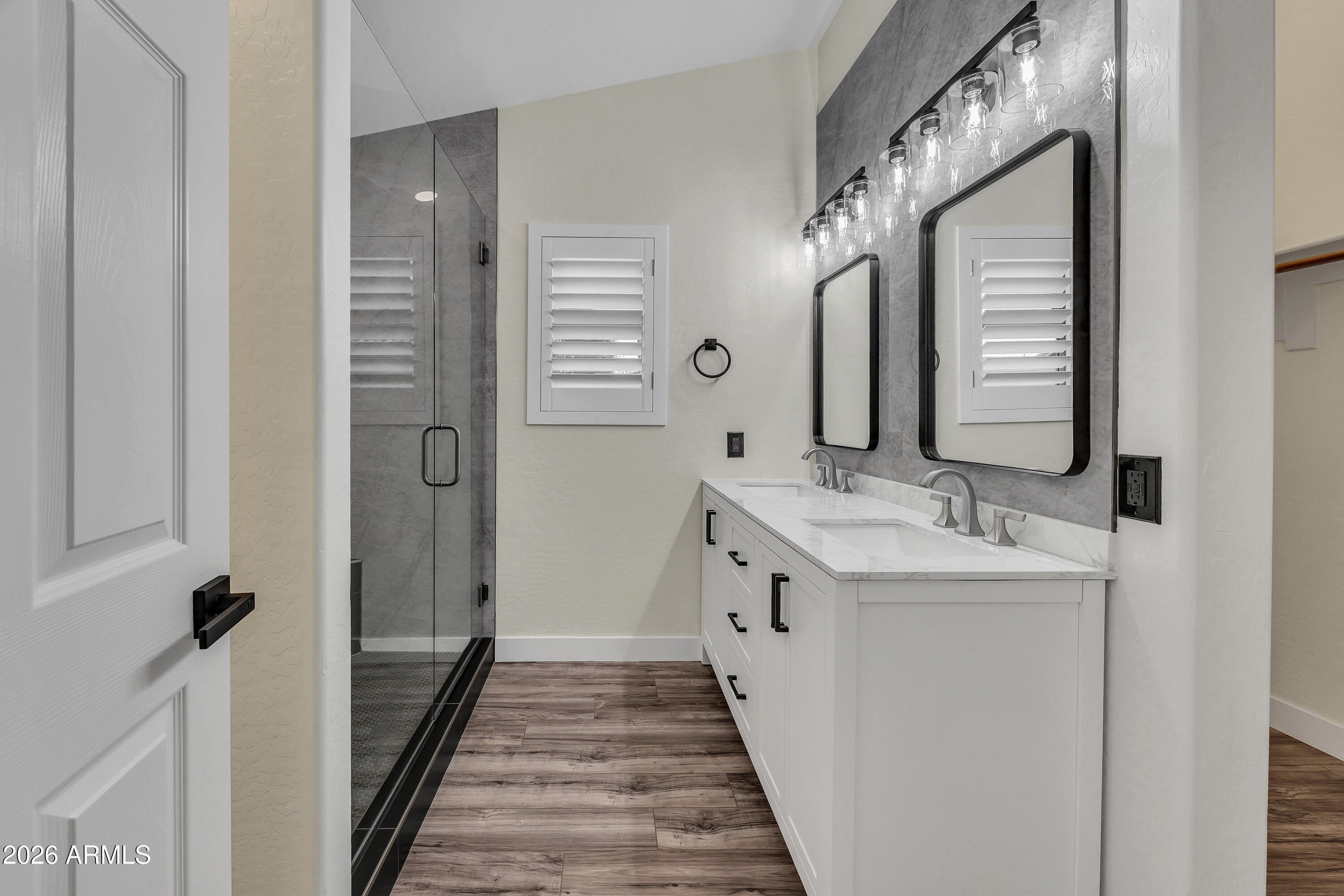 3283 East Bonanza Road Gilbert, AZ 85297 - Photo 27 of 31 a bathroom with a double vanity sink and mirror
