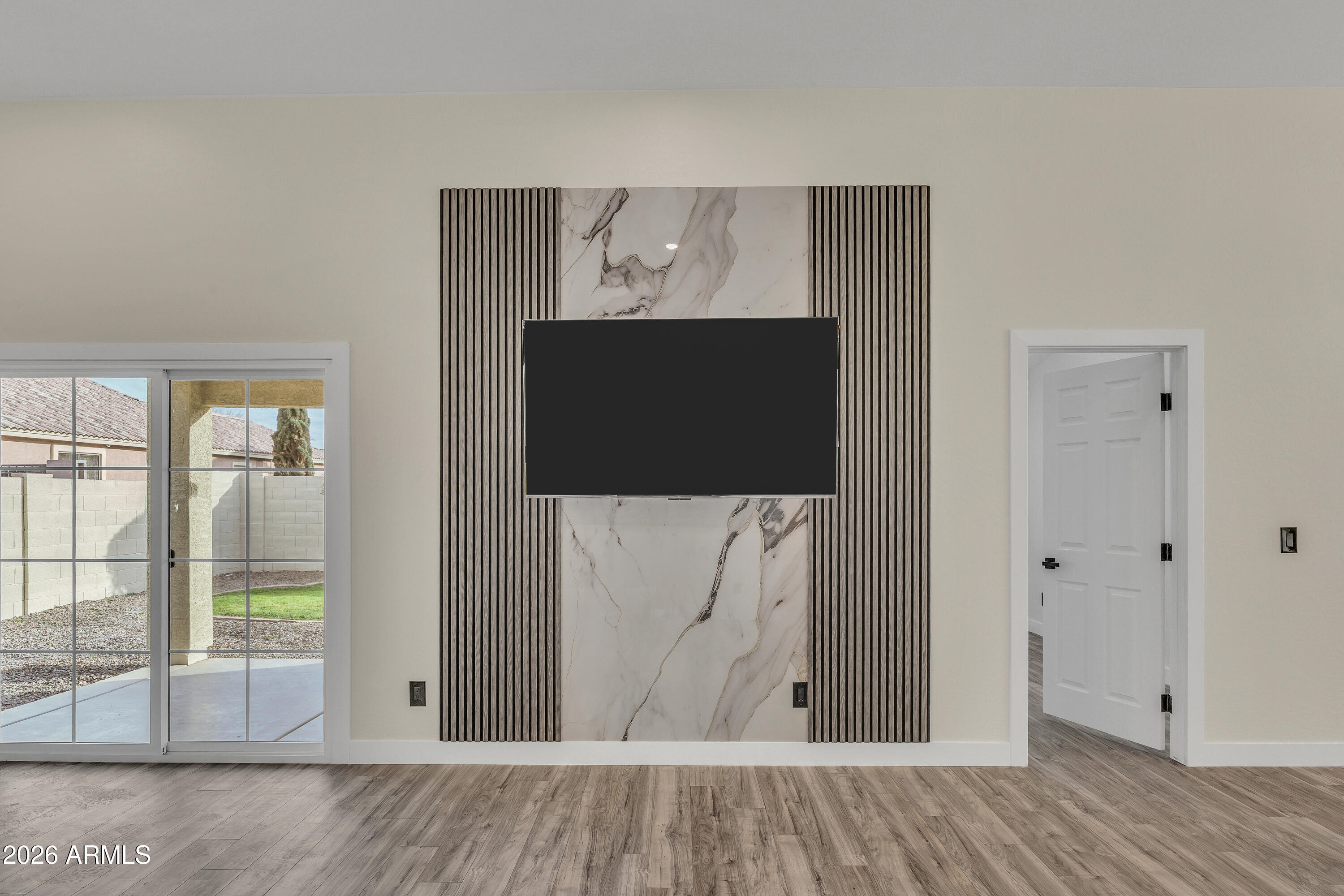 3283 East Bonanza Road Gilbert, AZ 85297 - Photo 7 of 31 an entryway view with wooden floor and front door