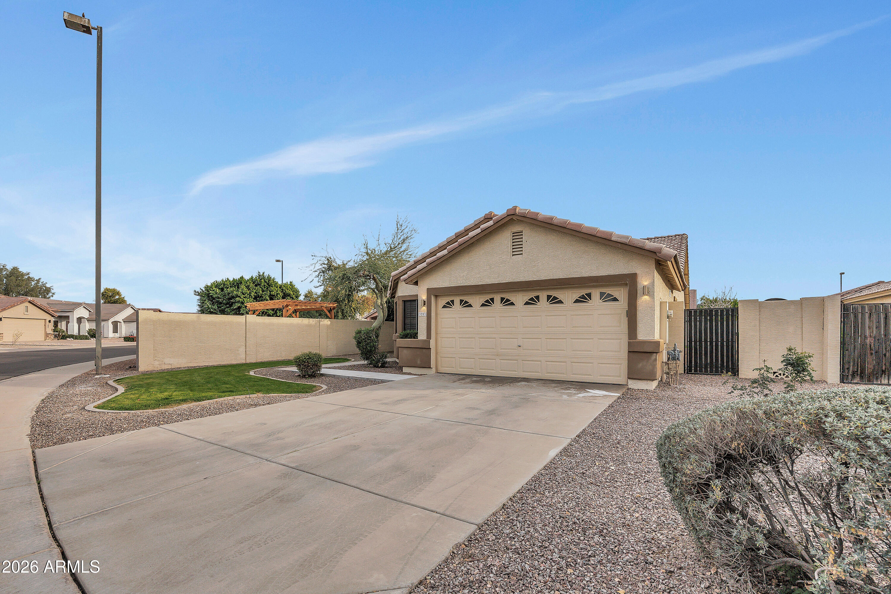 3283 East Bonanza Road Gilbert, AZ 85297 - Photo 10 of 31 a view of a house with a yard and potted plants
