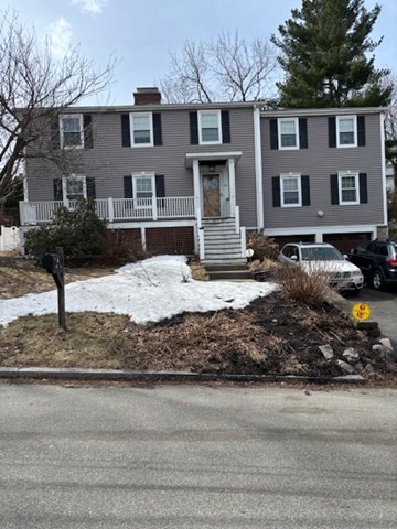 34 Robinhood Road Winchester, MA 01890 - Photo 2 of 2 a view of a yard in front of a house