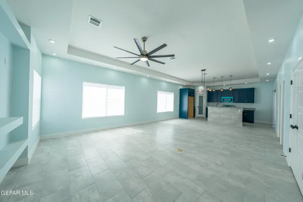 a kitchen with granite countertop a stove and a sink