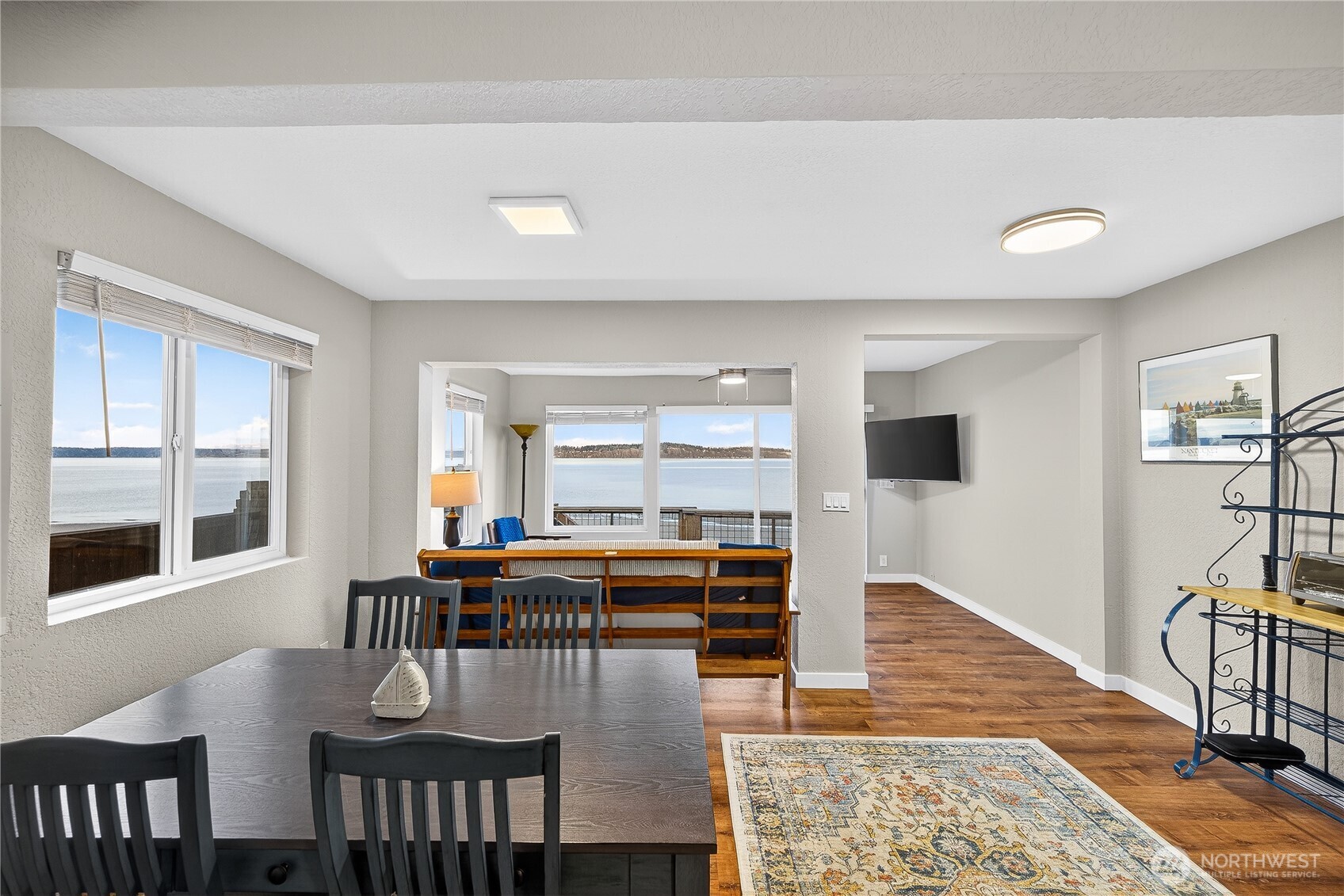 5972 Hastings Road Clinton, WA 98236 - Photo 22 of 40 a dining room with furniture and wooden floor