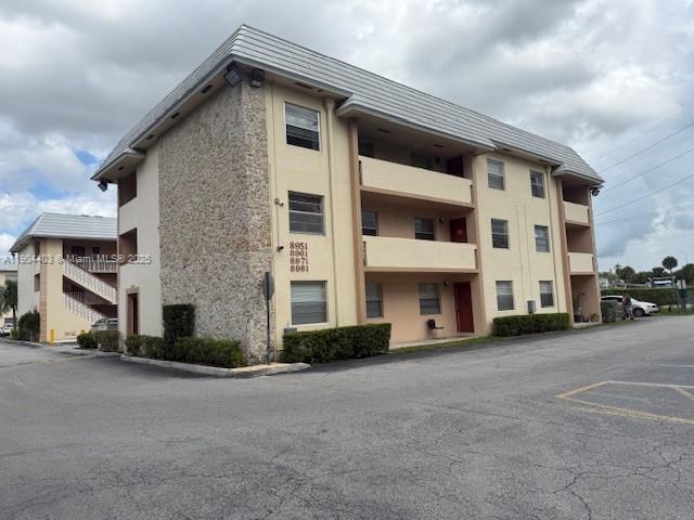 a view of a house with a street