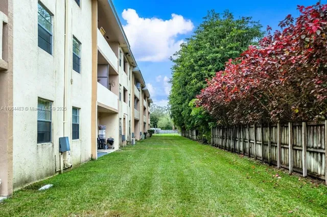 a view of an apartment with a garden