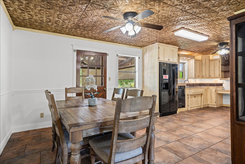2421 Post Oak Road Webberville, TX 78653 - Photo 8 of 36 Moving into the dining and kitchen area, you’ve got durable tile flooring that runs throughout.