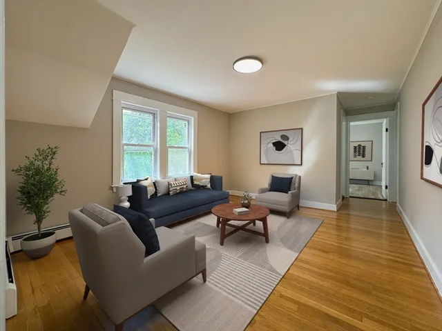 a living room with furniture and a rug