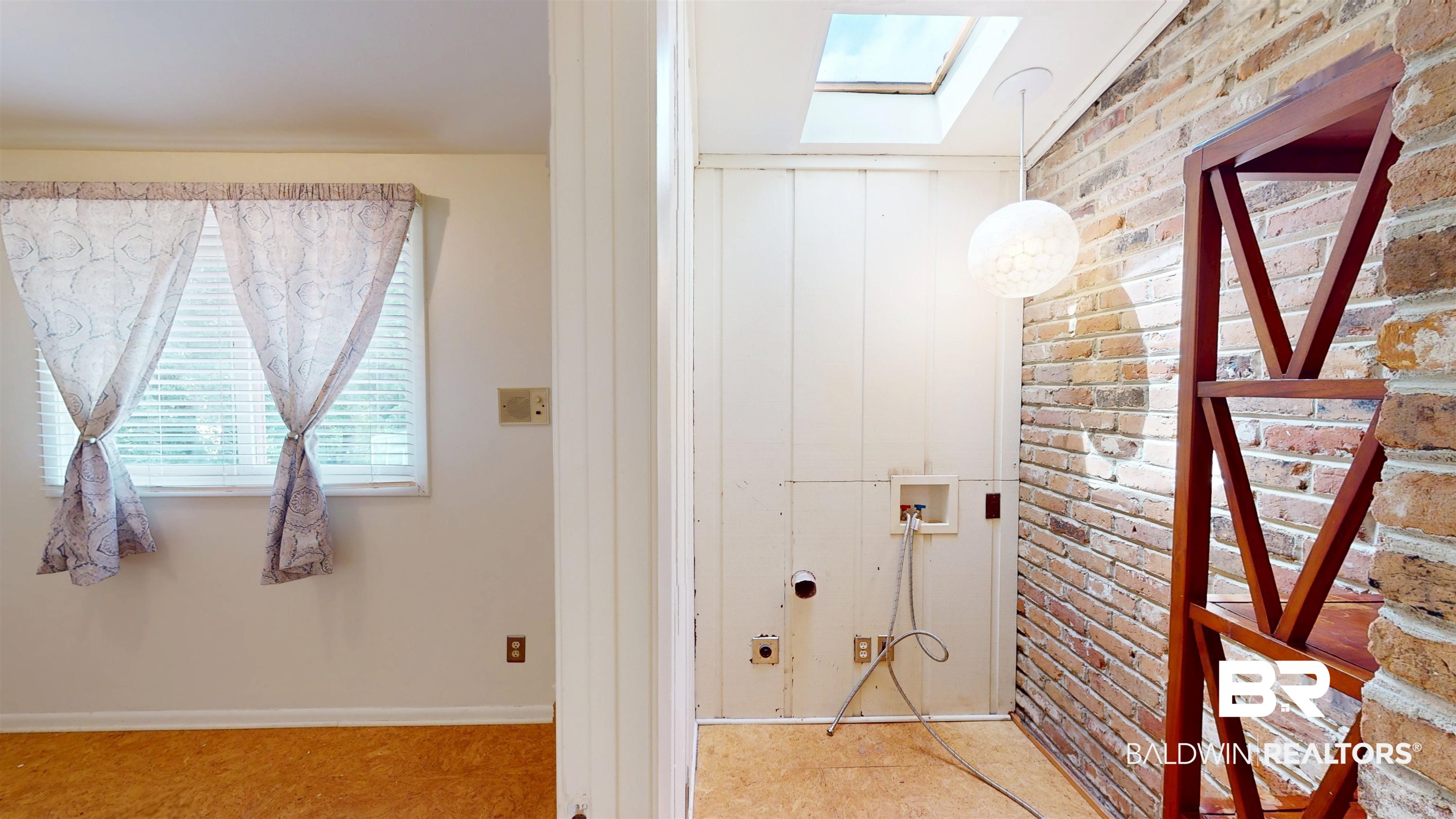 15 Spring Bank Road Mobile, AL 36608 - Photo 50 of 58 Bathroom featuring a skylight and brick wall