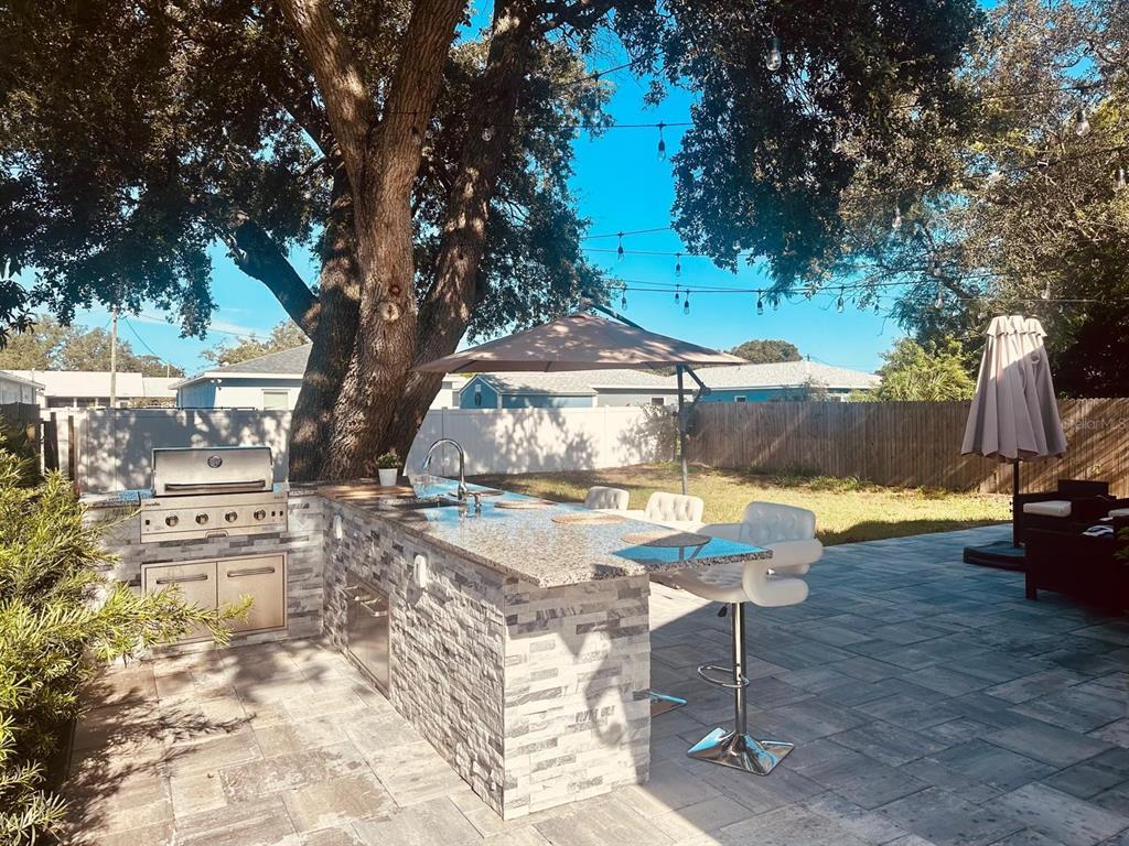 13272 Helm Street Largo, FL 33774 - Photo 14 of 20 a view of a backyard with swimming pool