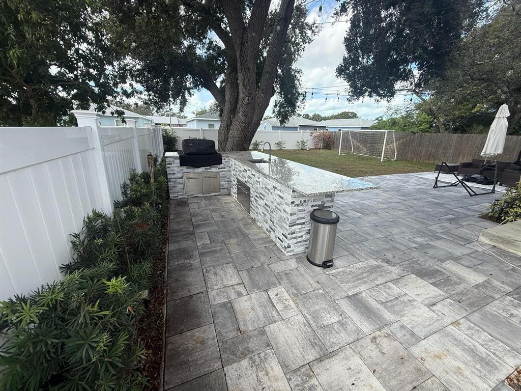13272 Helm Street Largo, FL 33774 - Photo 16 of 20 a view of swimming pool with a patio