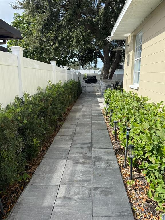 13272 Helm Street Largo, FL 33774 - Photo 19 of 20 a view of a pathway with flower pots