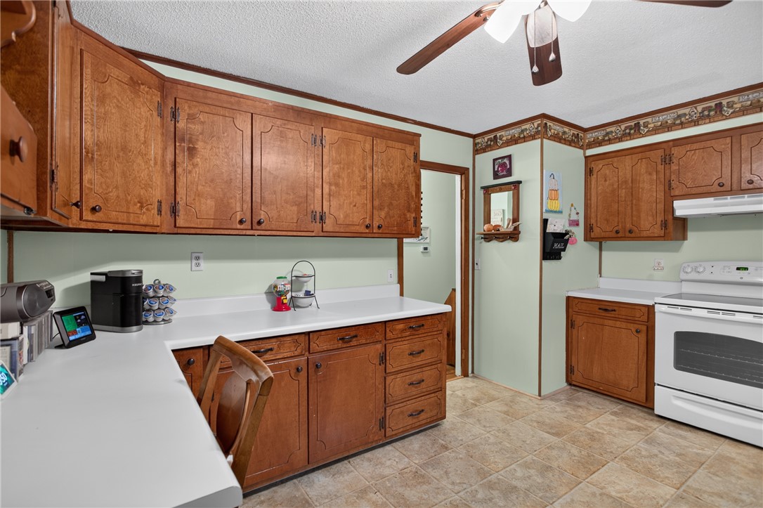 104 Laurel Lane Seneca, SC 29678 - Photo 9 of 36 Functional kitchen with ample cabinetry and comfortable tile flooring for everyday living.