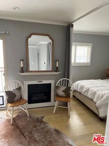 a bedroom with a bed and a fireplace
