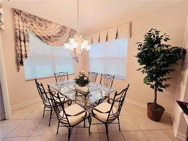 a view of a chairs and table in patio