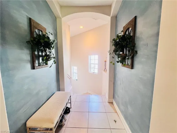 a room with a window and a walk in closet