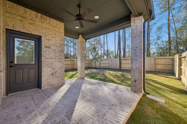 a view of swimming pool with outdoor seating and yard in the back