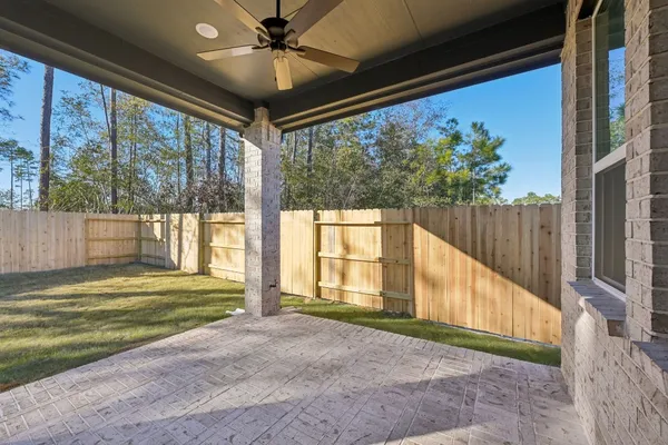 a green field with lots of tress in it