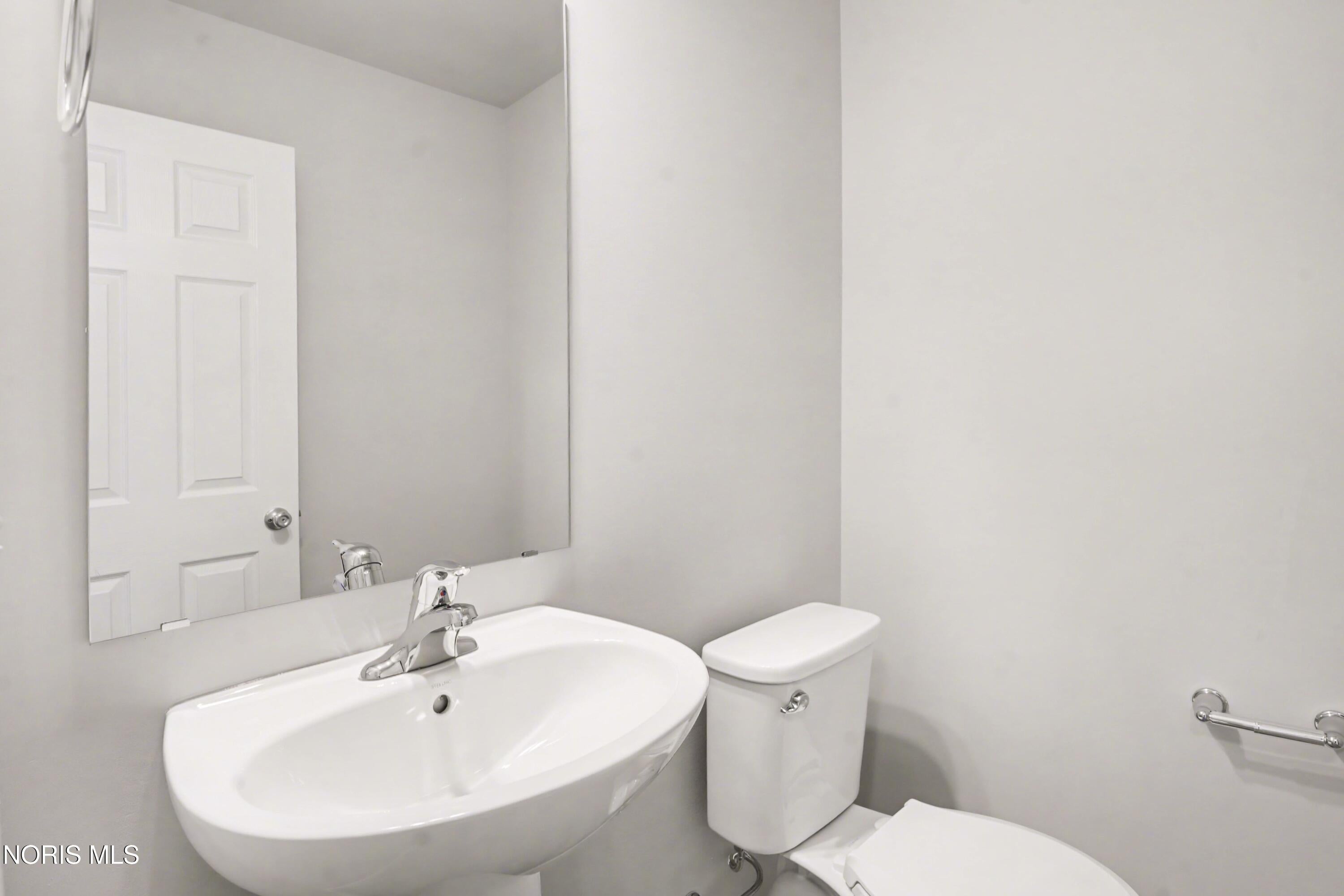 30643 Drouillard Road Walbridge, OH 43465 - Photo 10 of 28 First floor powder room is centrally located and easy for guests to use.