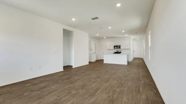 a view of a kitchen with a sink and cabinets
