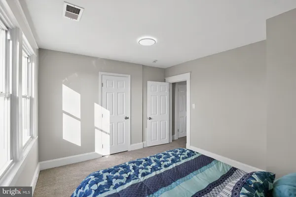 a bathroom with a toilet and a bathtub