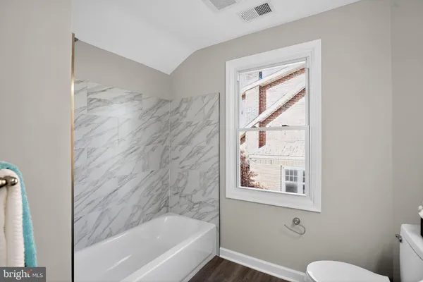 a en suite bathroom with a sink and shower