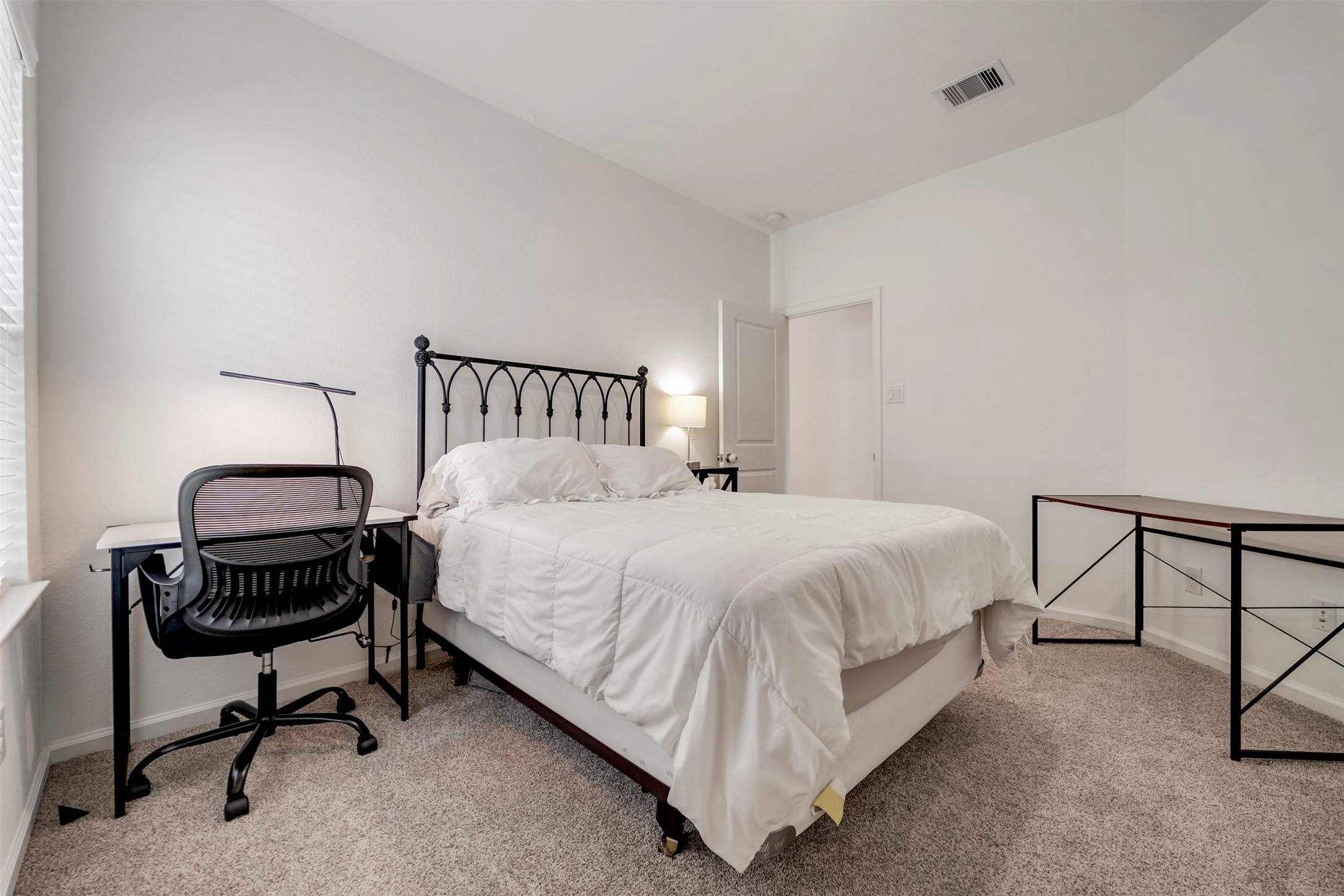 4127 Champlain Way Iowa Colony, TX 77583 - Photo 25 of 35 a bedroom with a bed chair and dresser