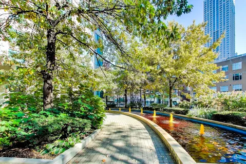 a view of house with yard and green space