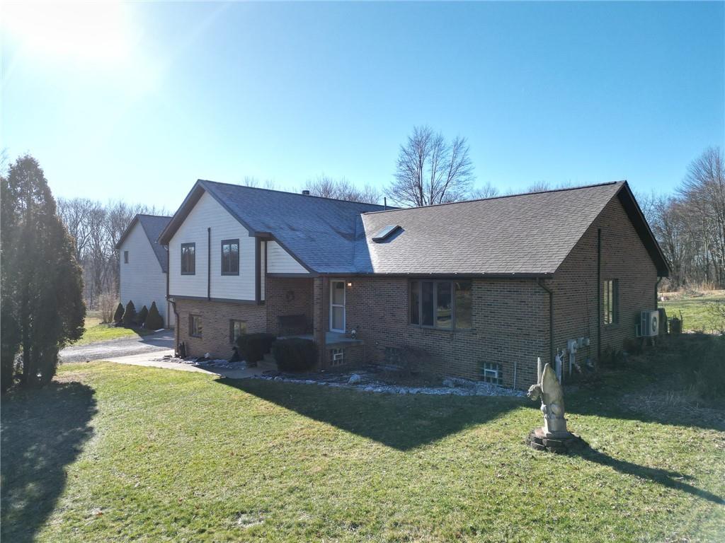 a backyard of a house with yard and garage