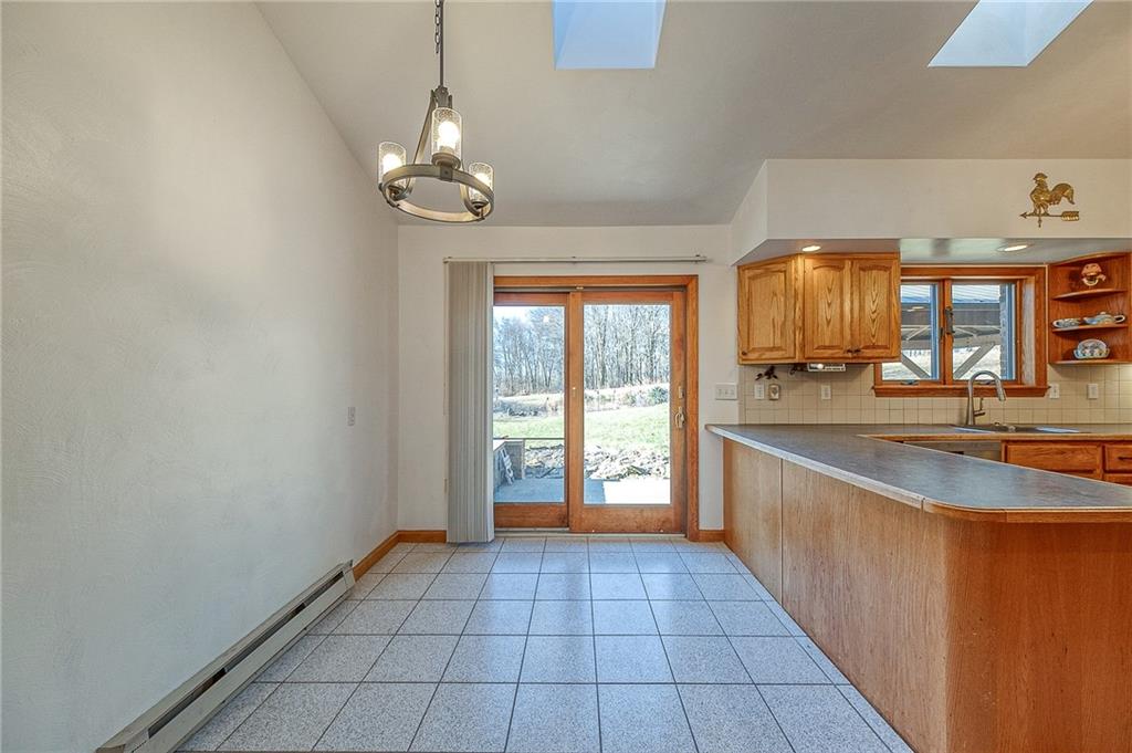 156 Critchlow School Road Renfrew, PA 16053 - Photo 21 of 49 a view of a kitchen with a sink and a window