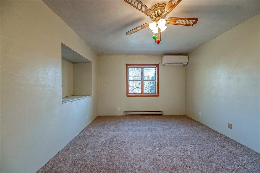 156 Critchlow School Road Renfrew, PA 16053 - Photo 44 of 49 an empty room with chandelier fan and windows