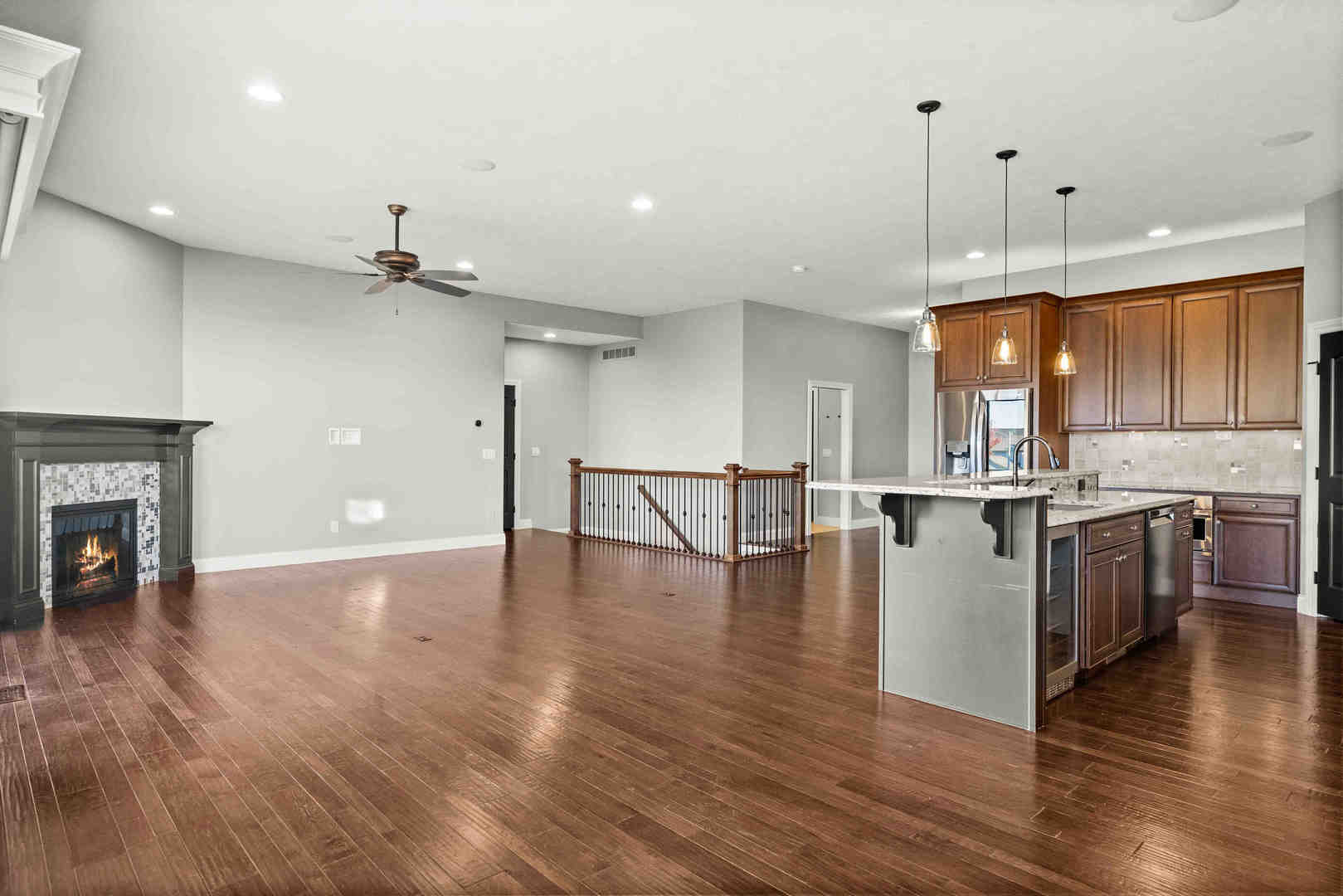 2526 Red Rock Road Normal, IL 61761 - Photo 14 of 38 a view of a kitchen and an empty room with wooden floor