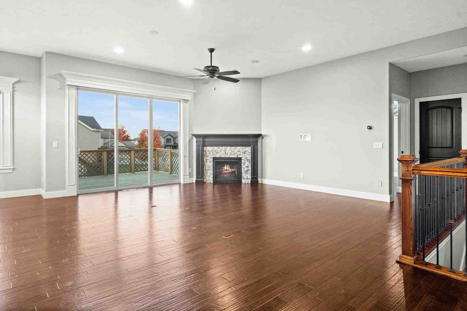 2526 Red Rock Road Normal, IL 61761 - Photo 15 of 38 a view of an empty room with wooden floor a fireplace and a window