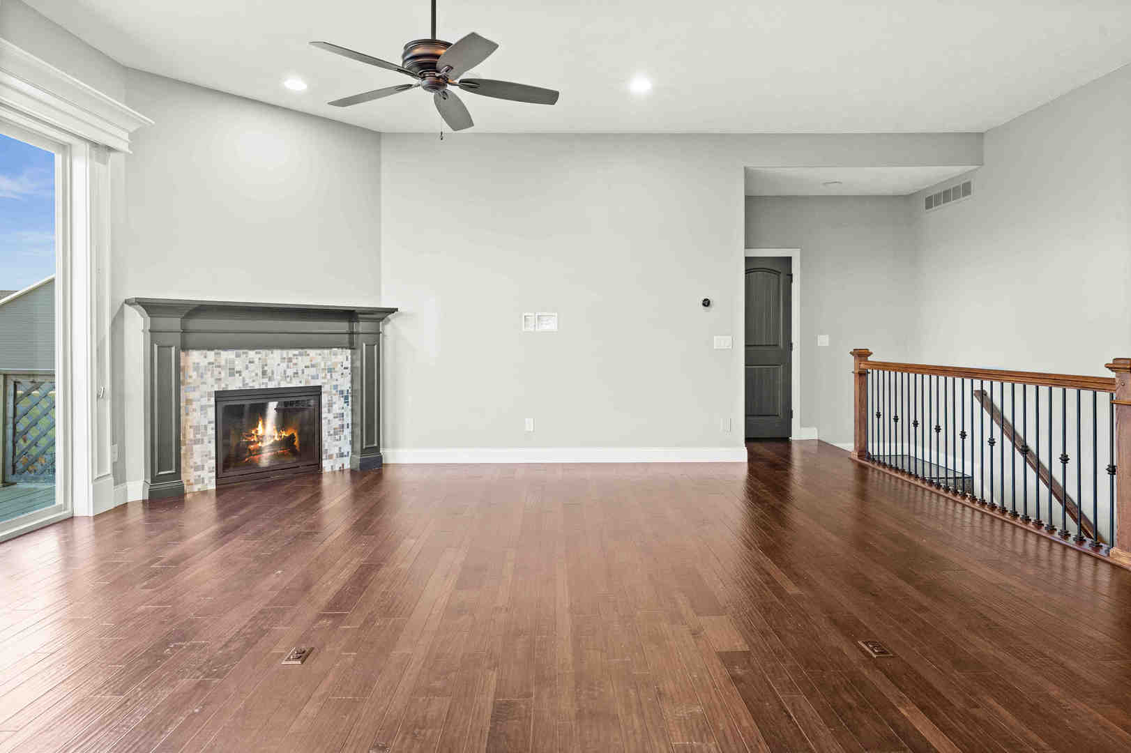 2526 Red Rock Road Normal, IL 61761 - Photo 16 of 38 a view of a livingroom with wooden floor and a fireplace