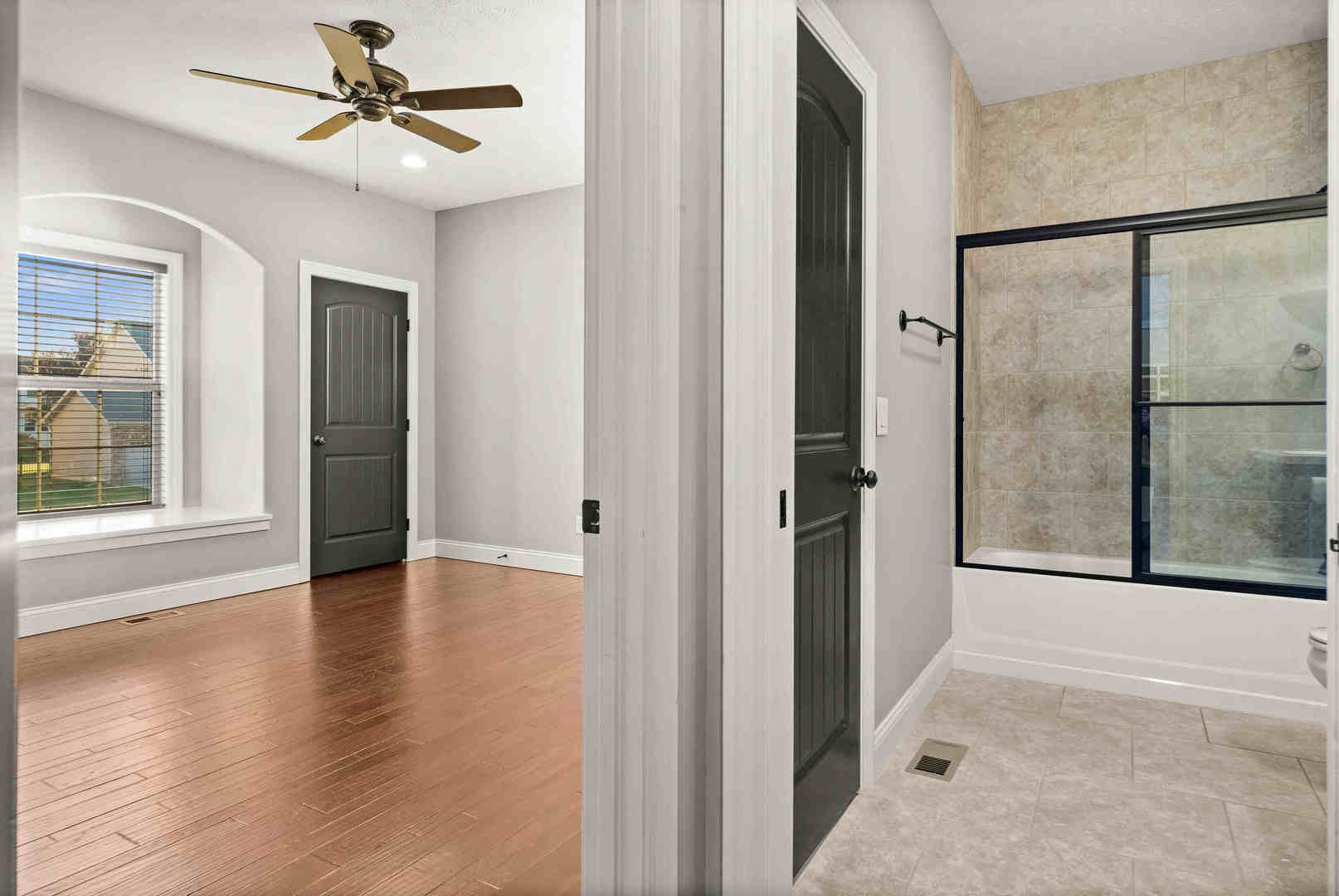 2526 Red Rock Road Normal, IL 61761 - Photo 7 of 38 an empty room with wooden floor and a ceiling fan