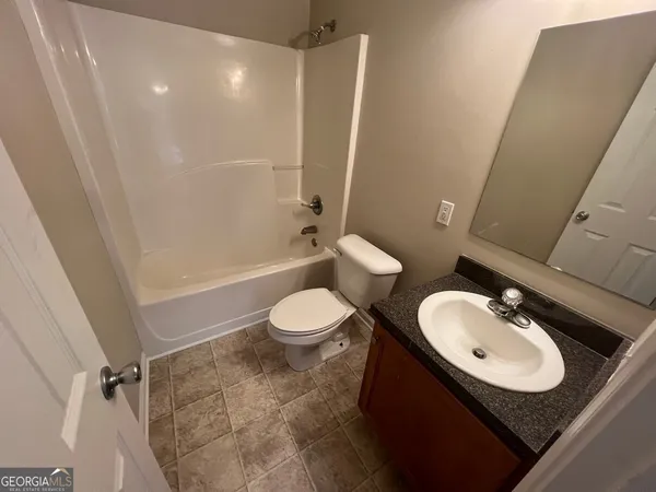 a bathroom with a sink and toilet