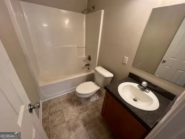a bathroom with a sink and toilet