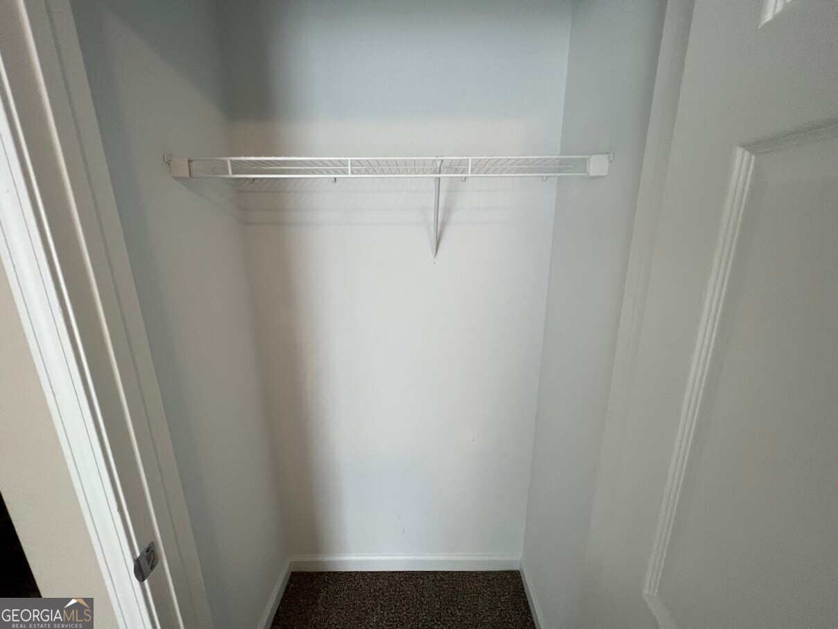 158 Elder Drive Southeast, Unit B Social Circle, GA 30025 - Photo 14 of 19 a close up view of racks on the wall