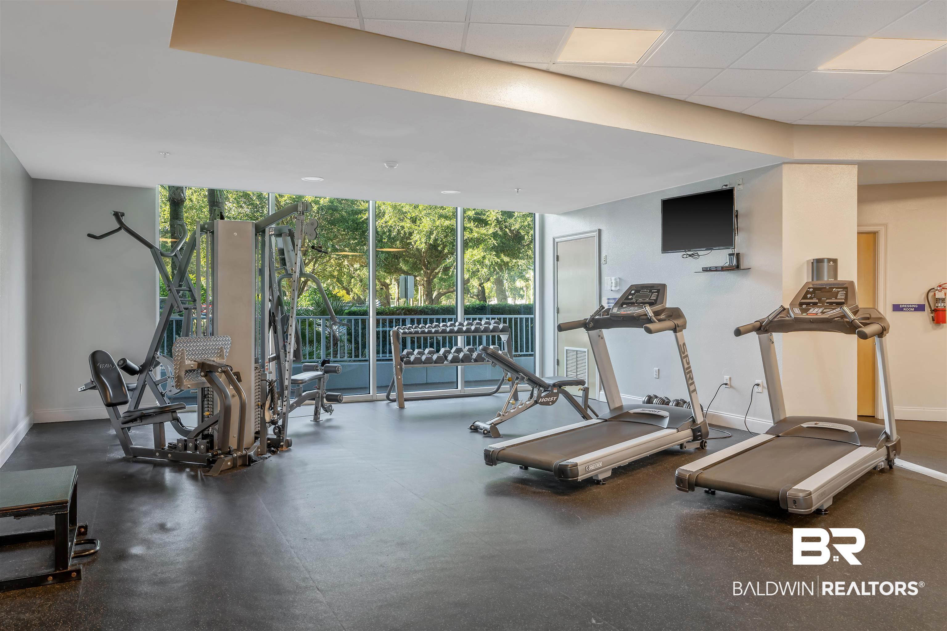 27800 Canal Road, Unit 113 Orange Beach, AL 36561 - Photo 26 of 35 Workout area with a wall of windows and a drop ceiling