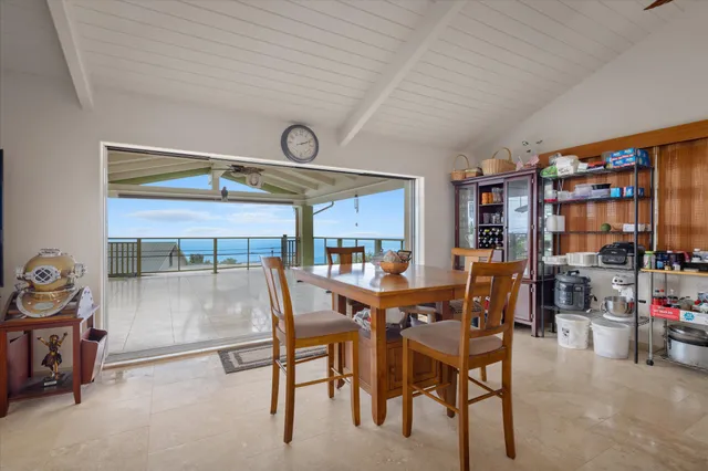 a living room filled with furniture and a flat screen tv