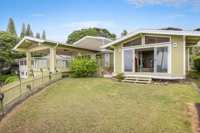 a view of a swimming pool with a lawn chairs